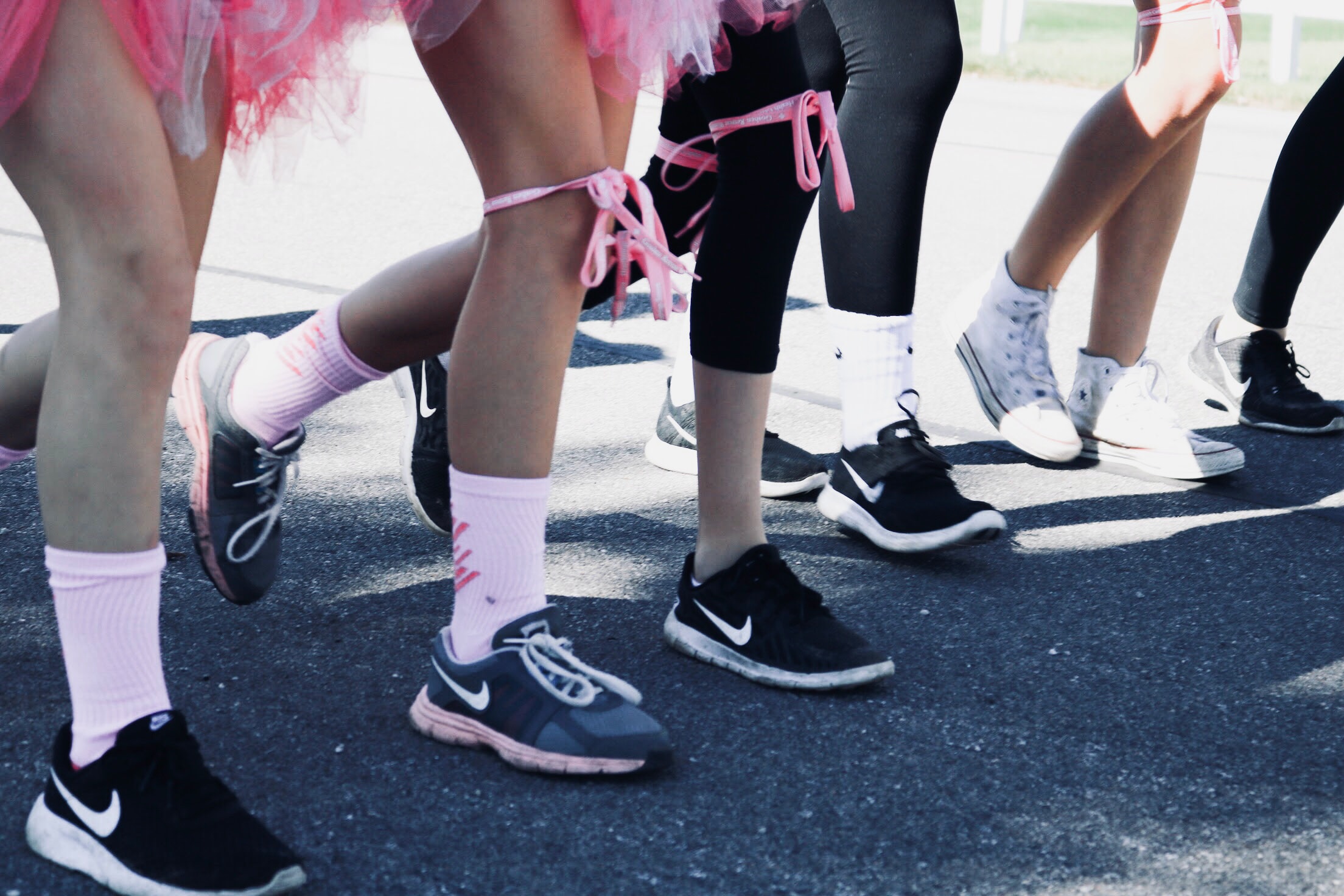 Marathon walkers and runners supporting breast cancer